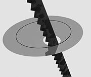 Silver sheet being cut with a saw